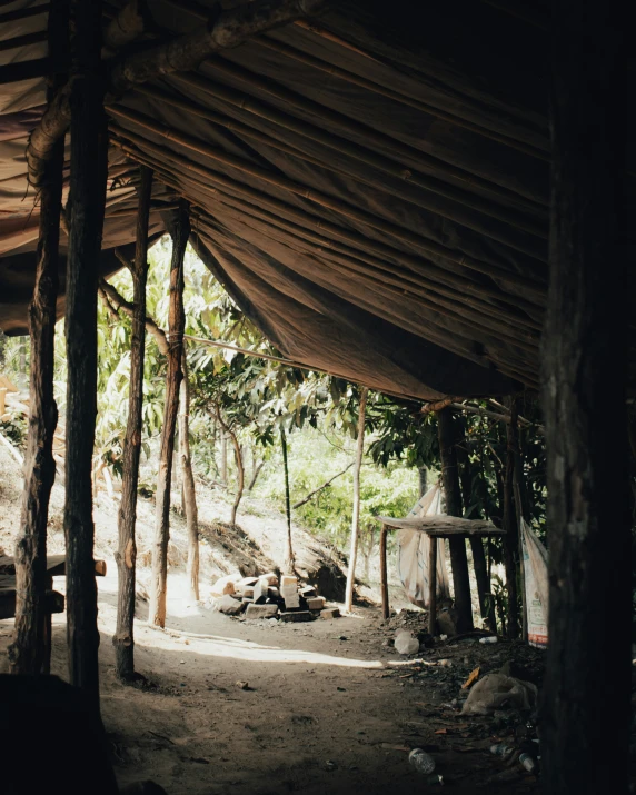 the inside of an old looking tent in the jungle