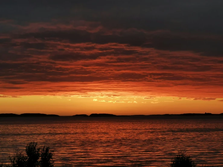 red and yellow colors rise above the water