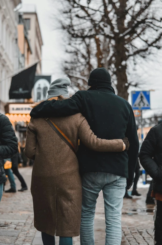 a couple walking down the street