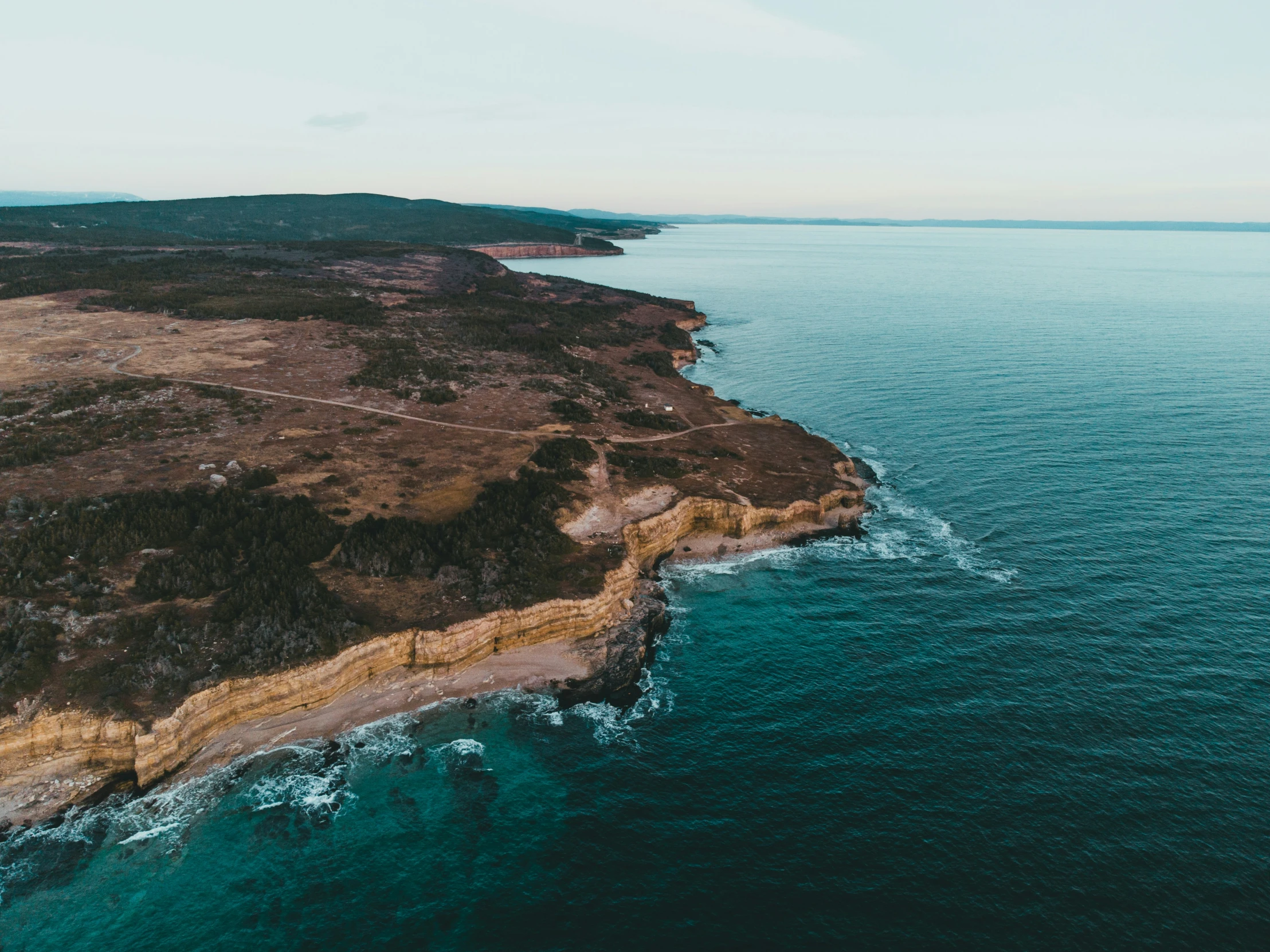 an aerial s of the ocean in a coastal region