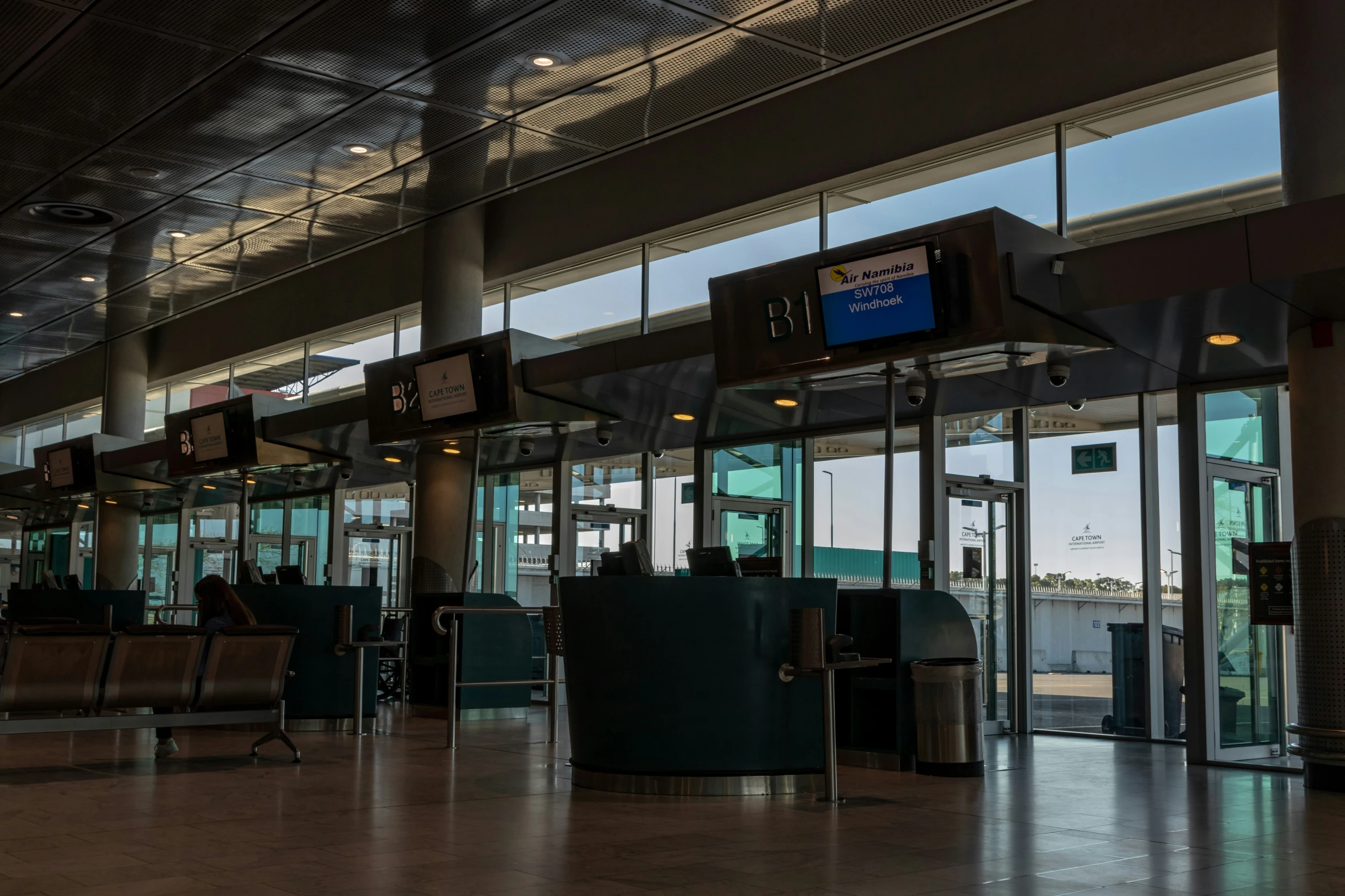 large airport entrance with lots of tables and chairs