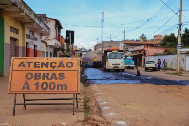 there is a street with a yellow sign