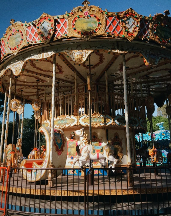 a merry go round is parked in the park