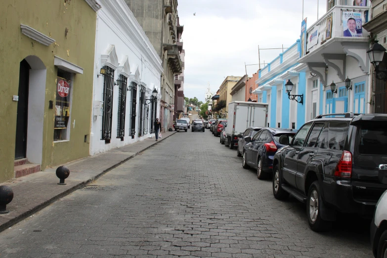 the cars are parked on the side of the street