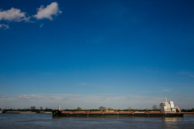 large barge in the water heading towards shore