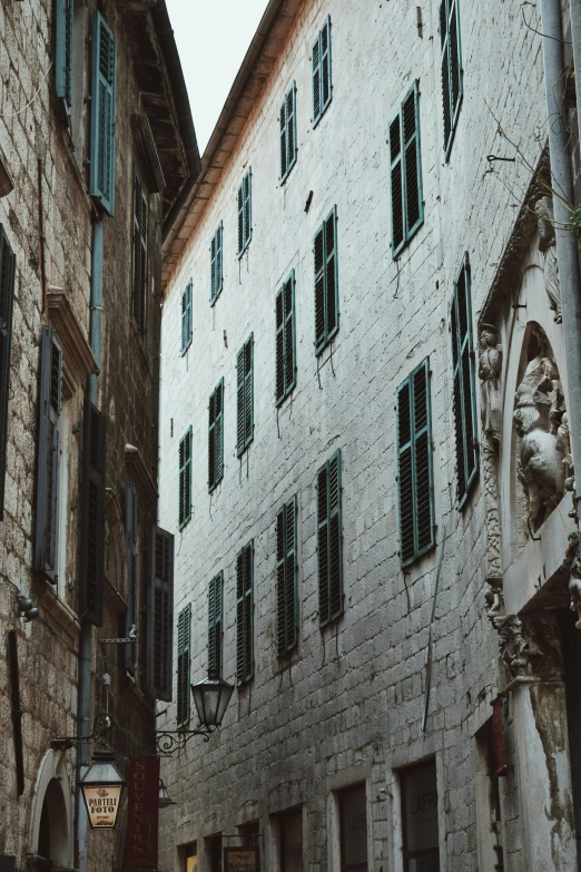 an old street in europe with an old stone building