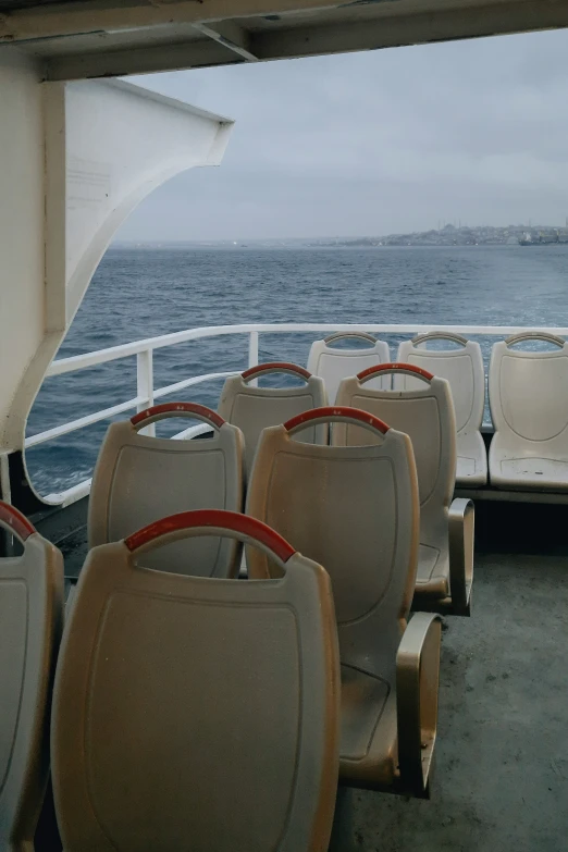 seats on the deck of a ferry are empty