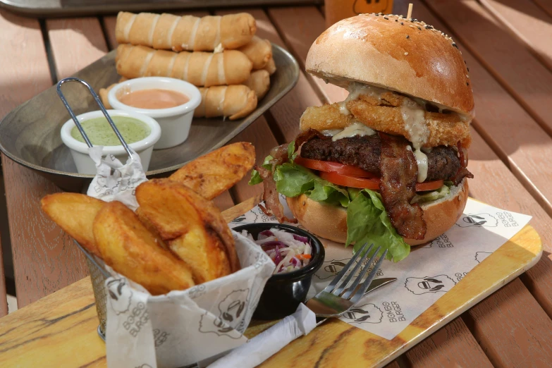 a hamburger and fries are on the tray