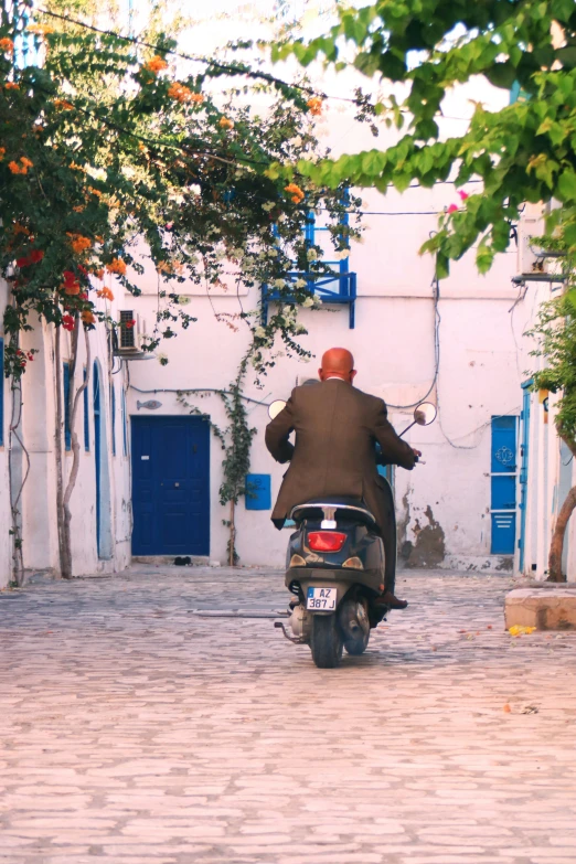 a man that is on a motorbike in the street