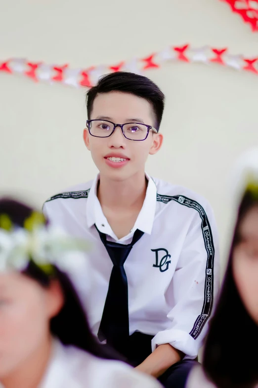 two boys with glasses one boy in uniform