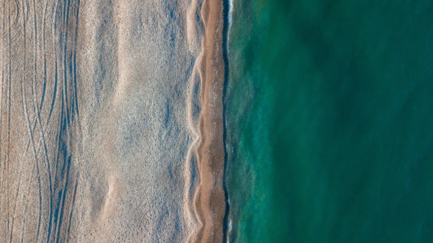 a view of an airplane flying over the ocean