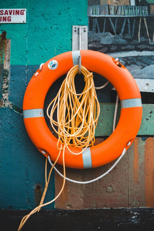 a life preserver is attached to the side of a building