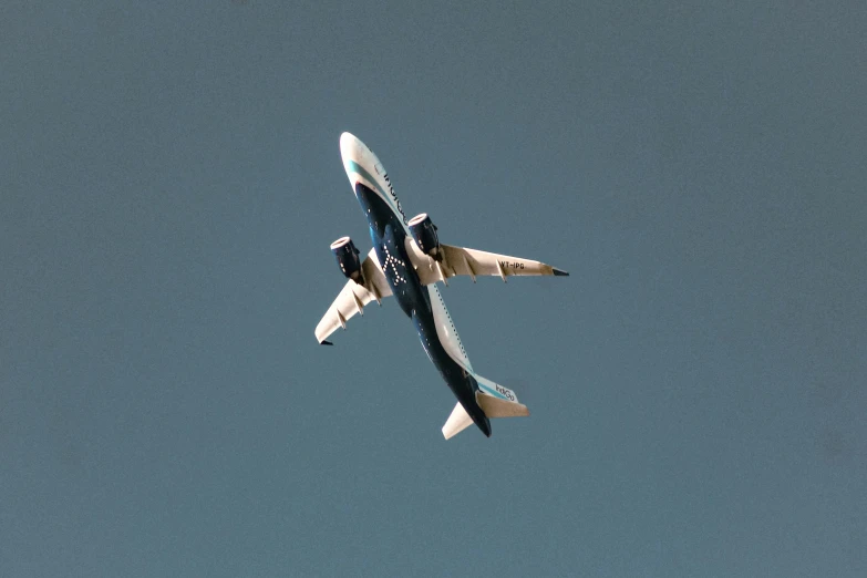 two airplanes that are flying side by side