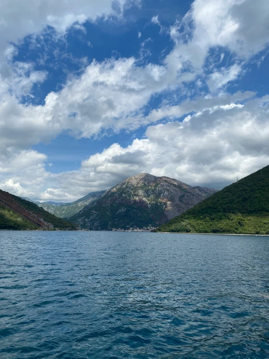 the sky above the water is cloudy with clouds