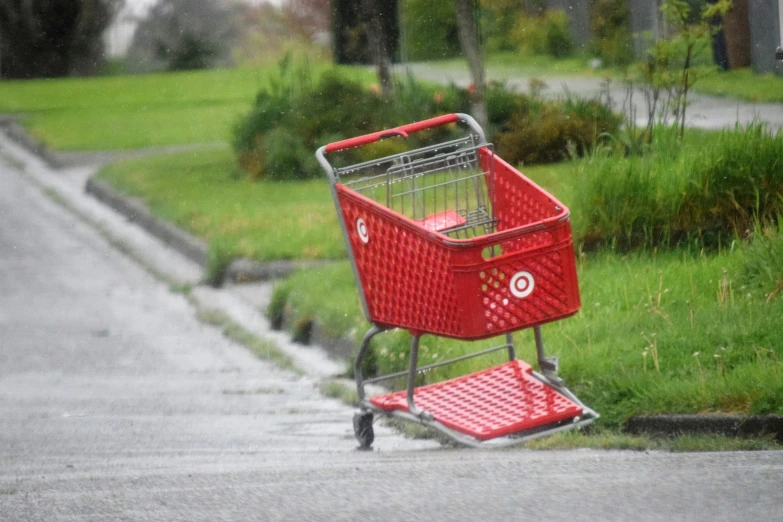 the shopping cart has a red handle