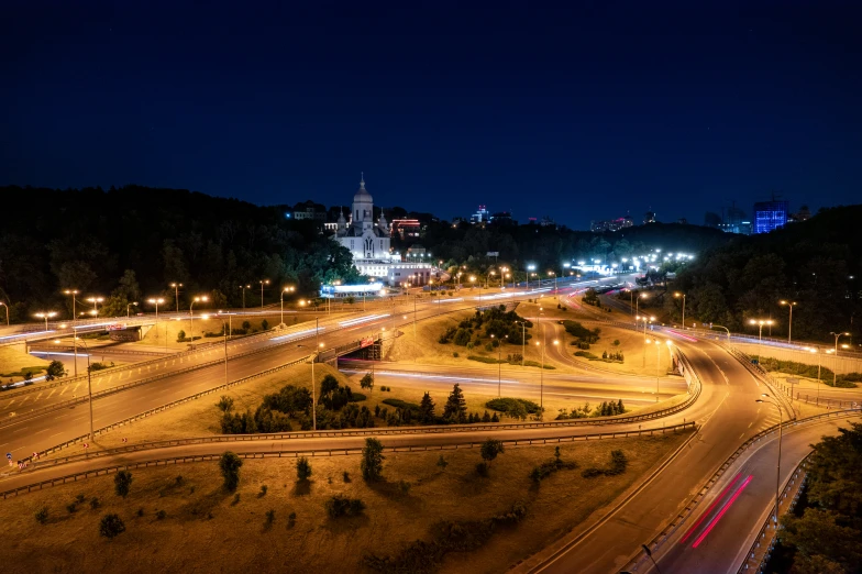 an intersection in the middle of the city at night