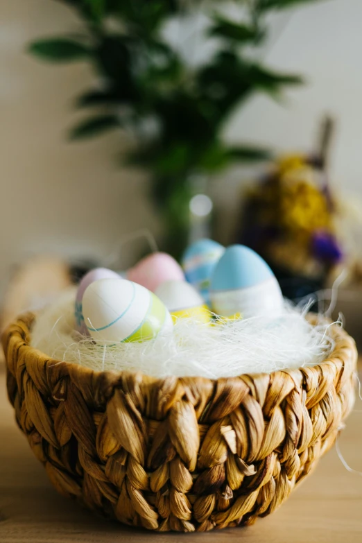 a basket with three eggs sitting in it