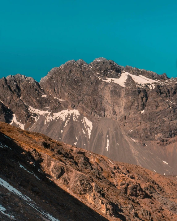 view of a mountain range covered in snow