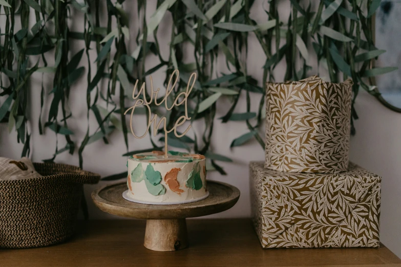 a wedding cake with floral patterns sitting on a table