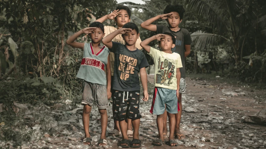 a group of boys standing together near each other