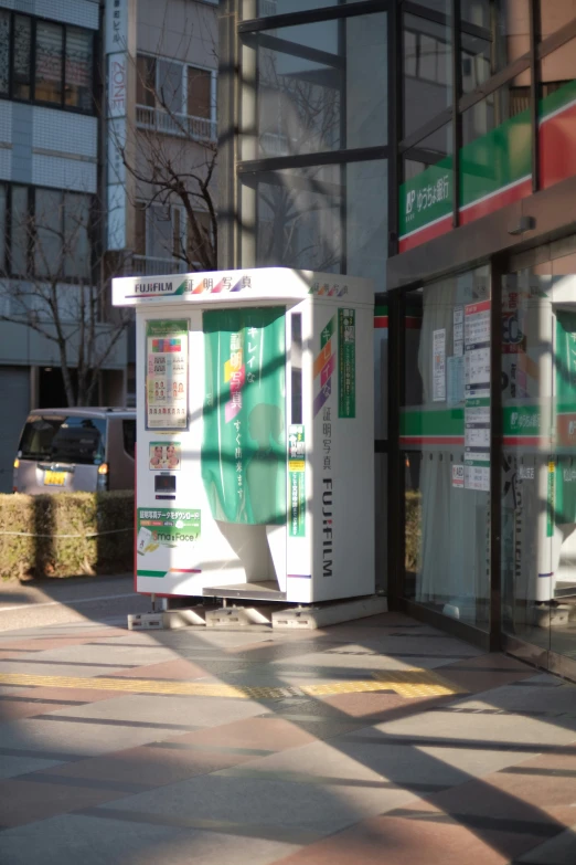 a machine on the corner of a sidewalk