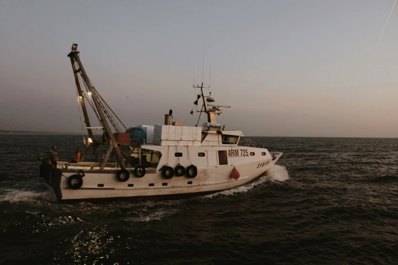 a boat is out on the ocean near the shore