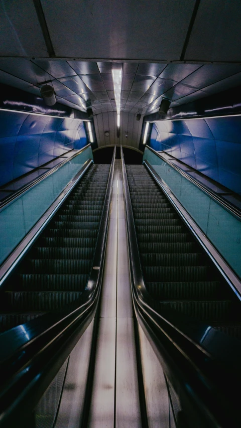 an empty escalator in a subway subway