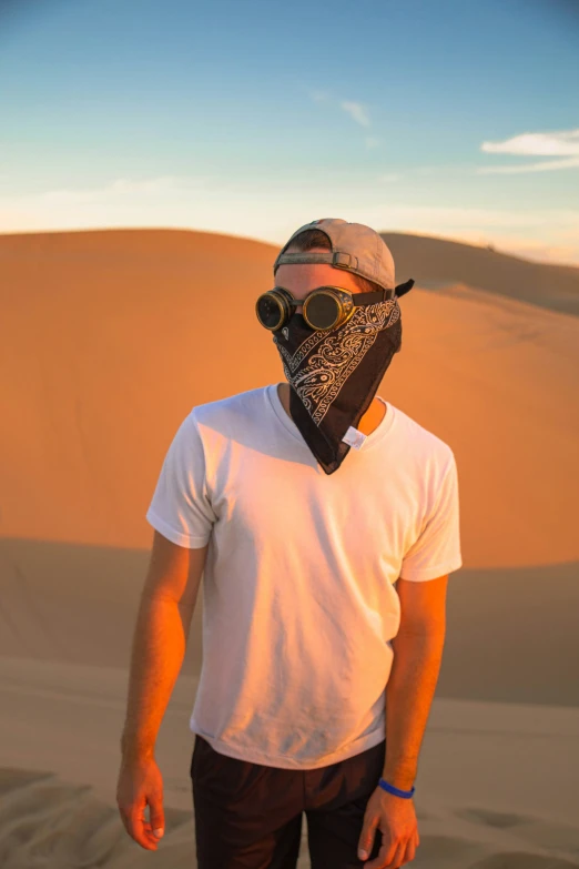 man wearing gas mask in the desert