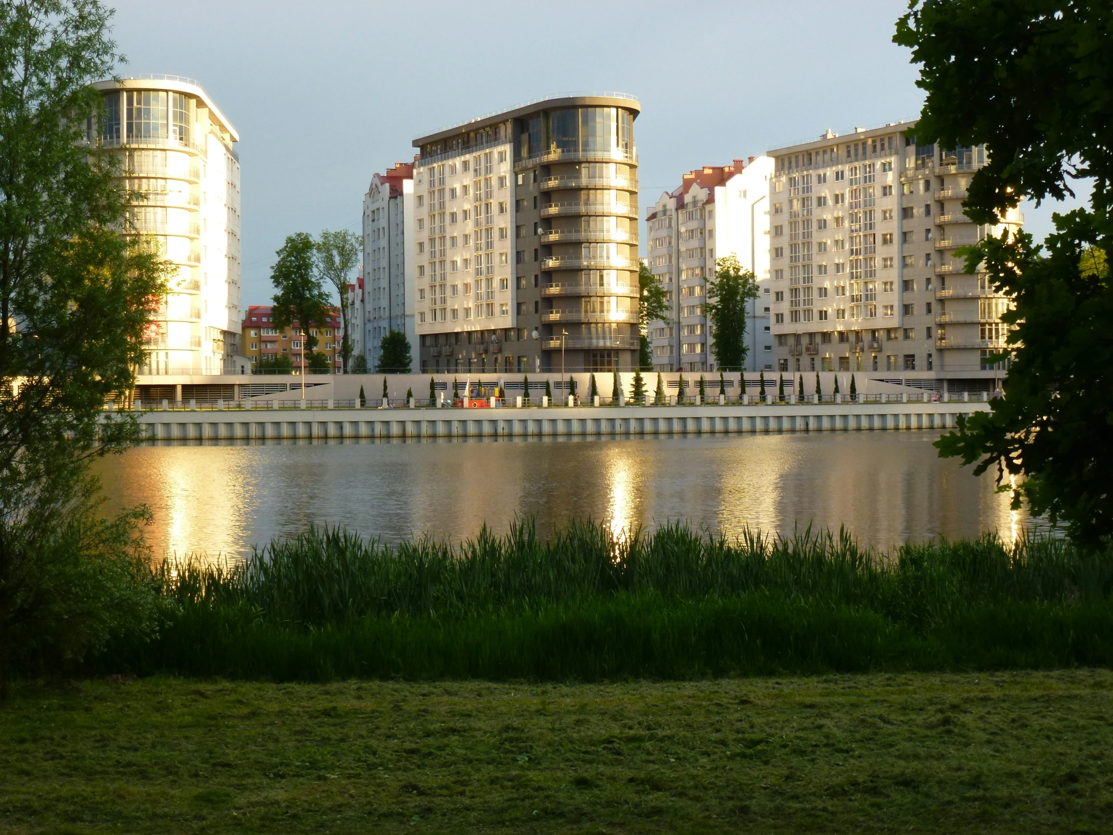 a lake with some buildings on top of it