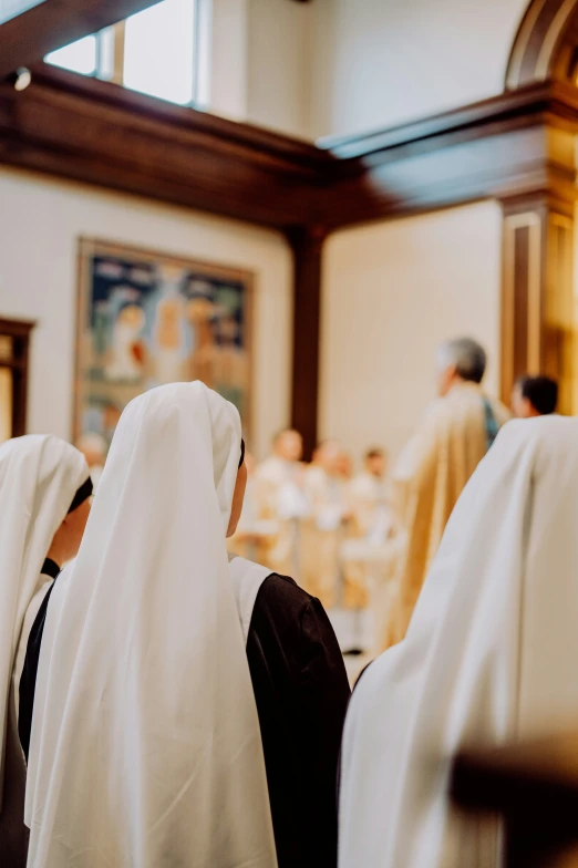 some women are wearing white and black clothing