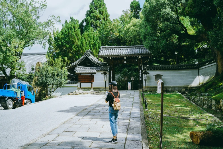 a woman in the middle of a driveway