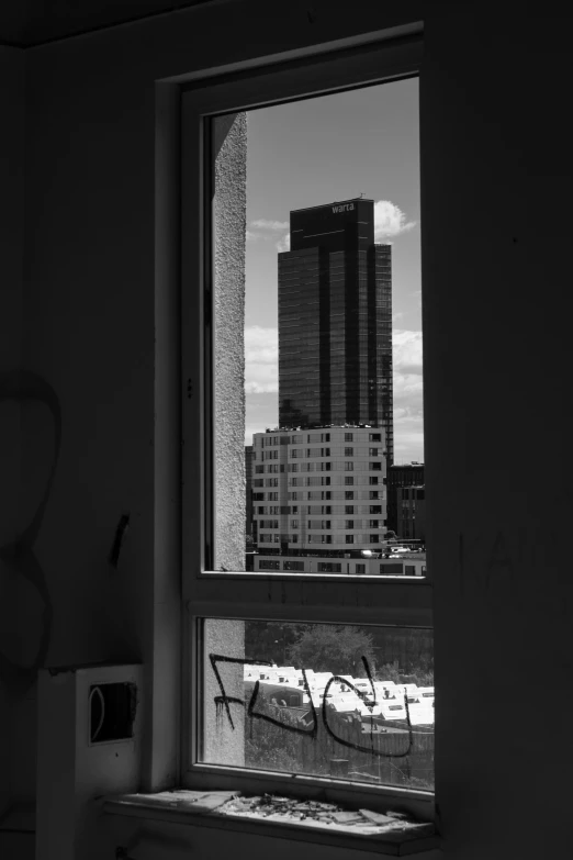 a large building seen out of a window in a room