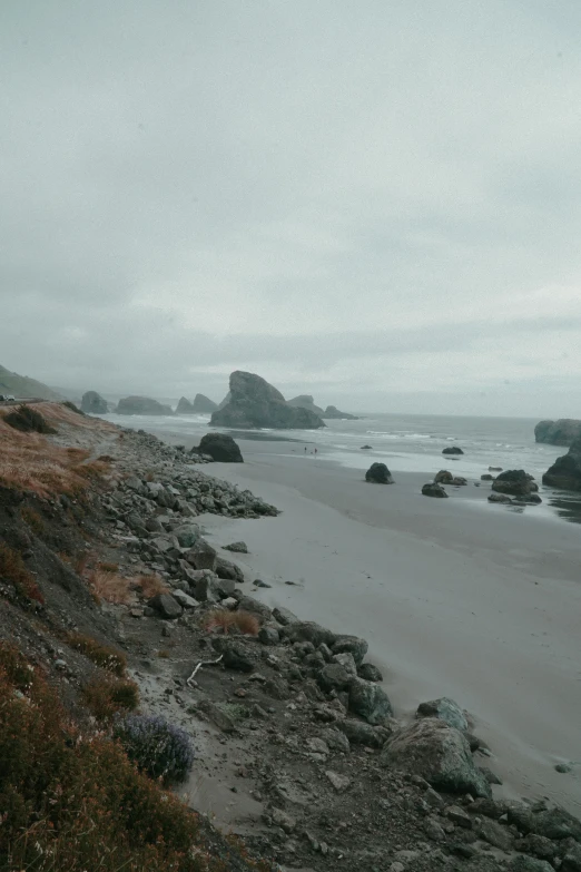 a deserted beach sits on the shore