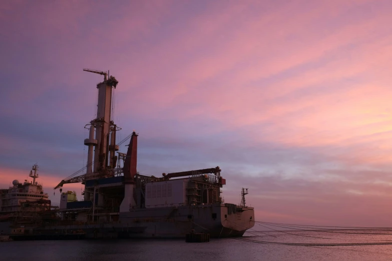 the ship is parked at the dock of a bay