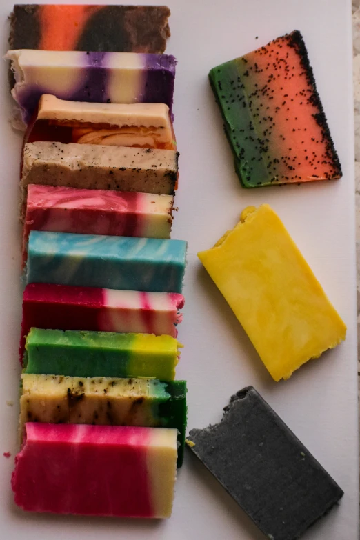 a rainbow tray has several different types of cake