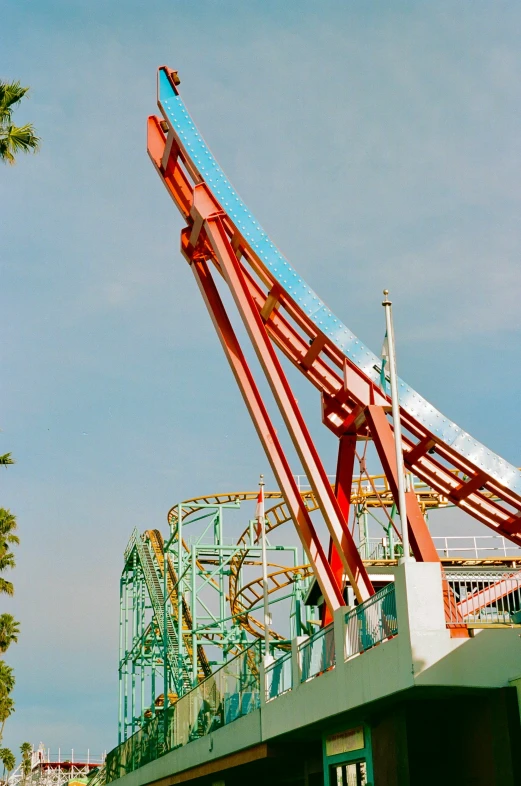 an amut park with multiple roller coasters and a clock