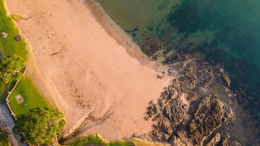 an aerial view of a sandy beach on an island