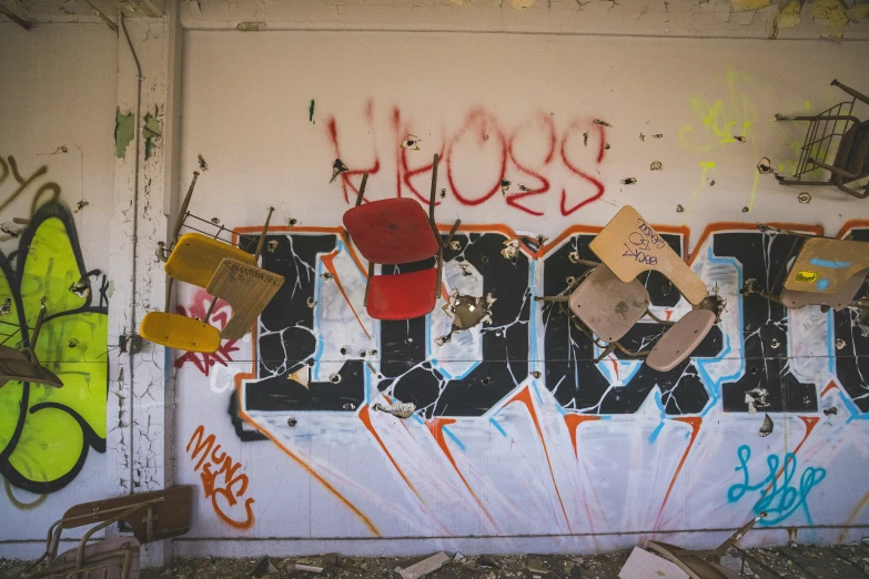 a wall with graffiti and erflies and a erfly