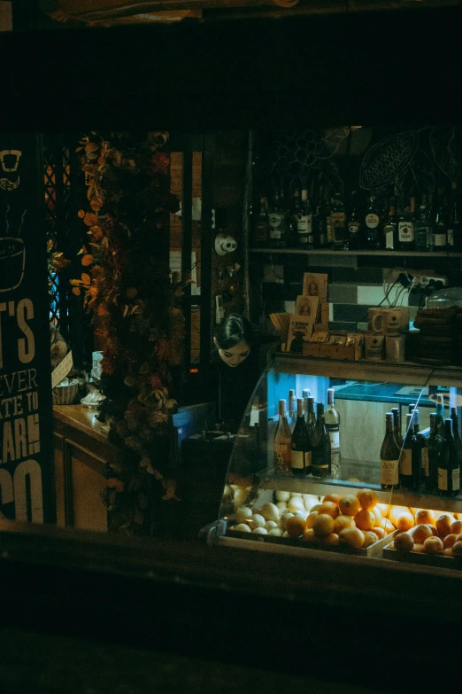 a bunch of bottles and shelves filled with different types of drinks