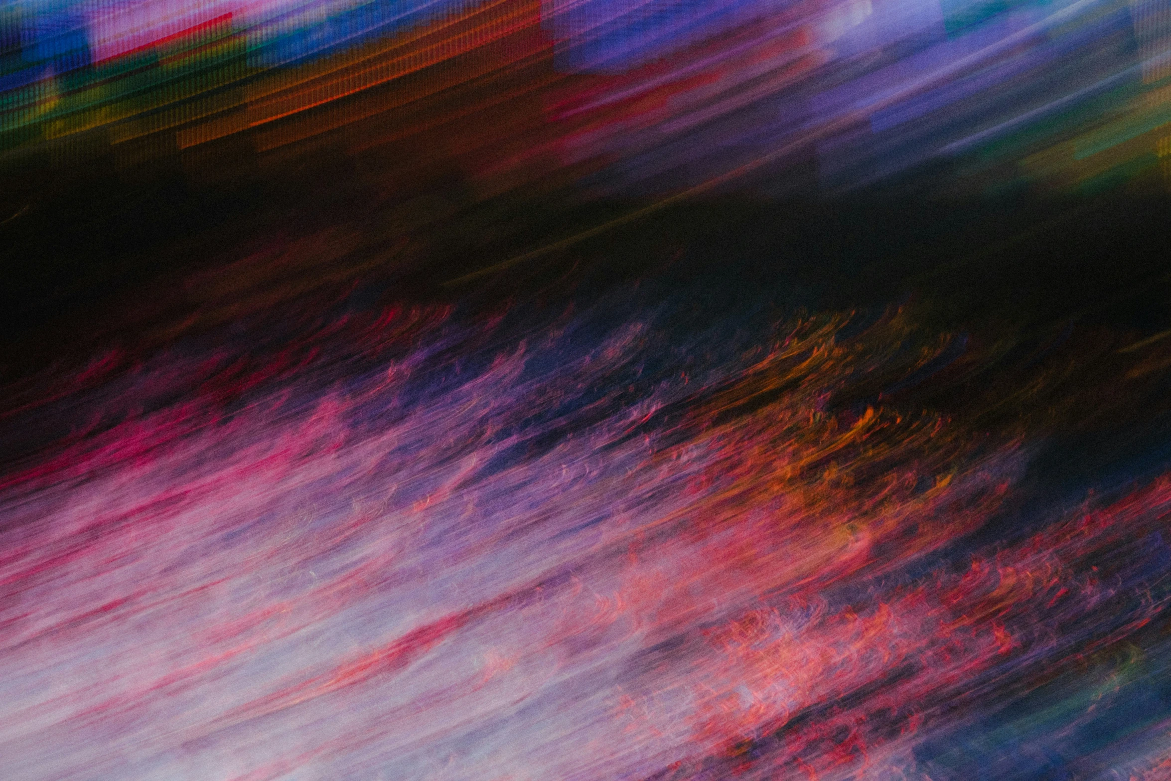 a colorful blurred image of red, pink and blue