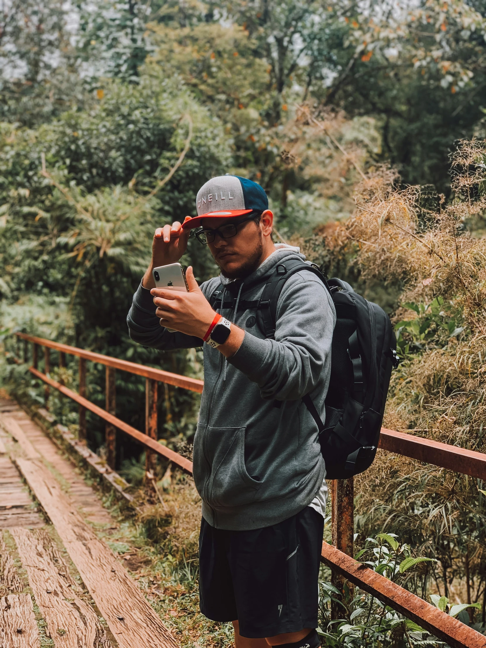 a young man taking a picture of soing