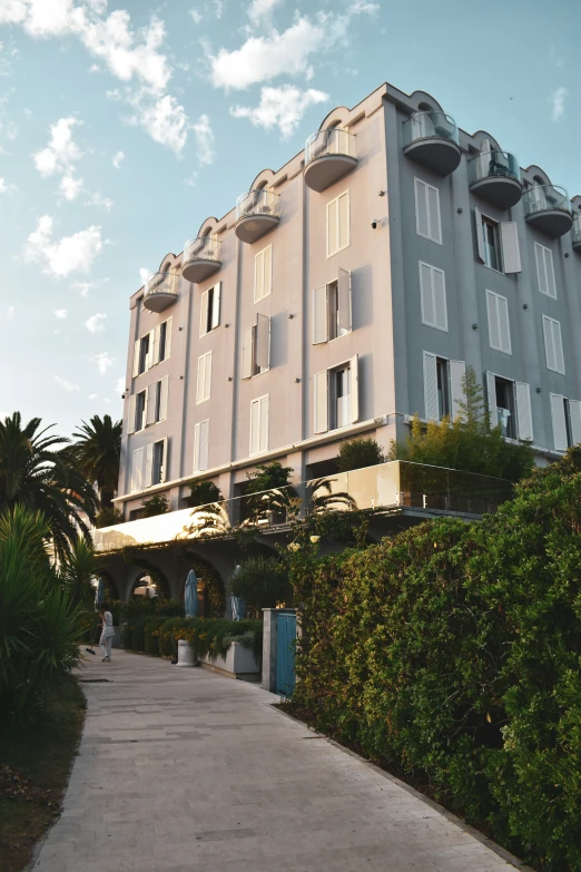 an architectural apartment building surrounded by shrubbery