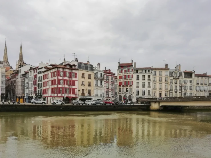 a river next to some tall buildings