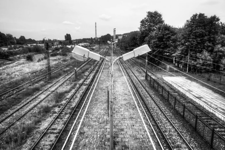 two broken white bags laying across the middle of tracks