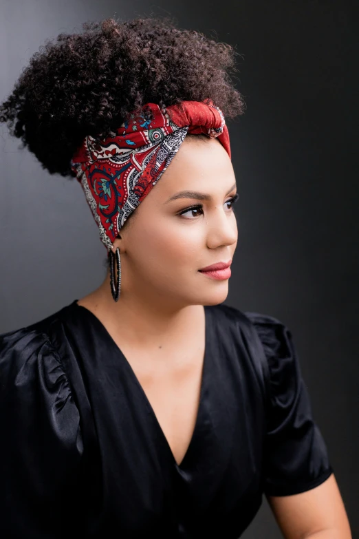 a woman with short hair has a bandana on her head