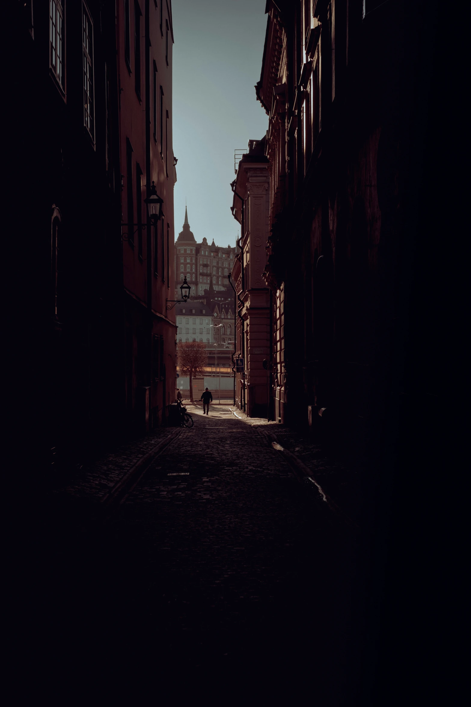 the shadow of an alley in an old city