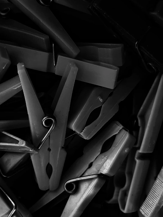 a pile of scissors are seen in this black and white po