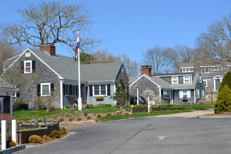 a street in front of several houses on a sunny day