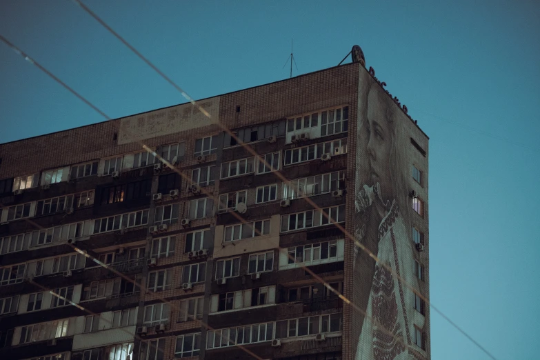 a large building sitting in front of a blue sky