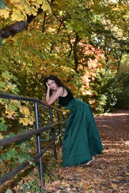 a woman standing on top of a railing